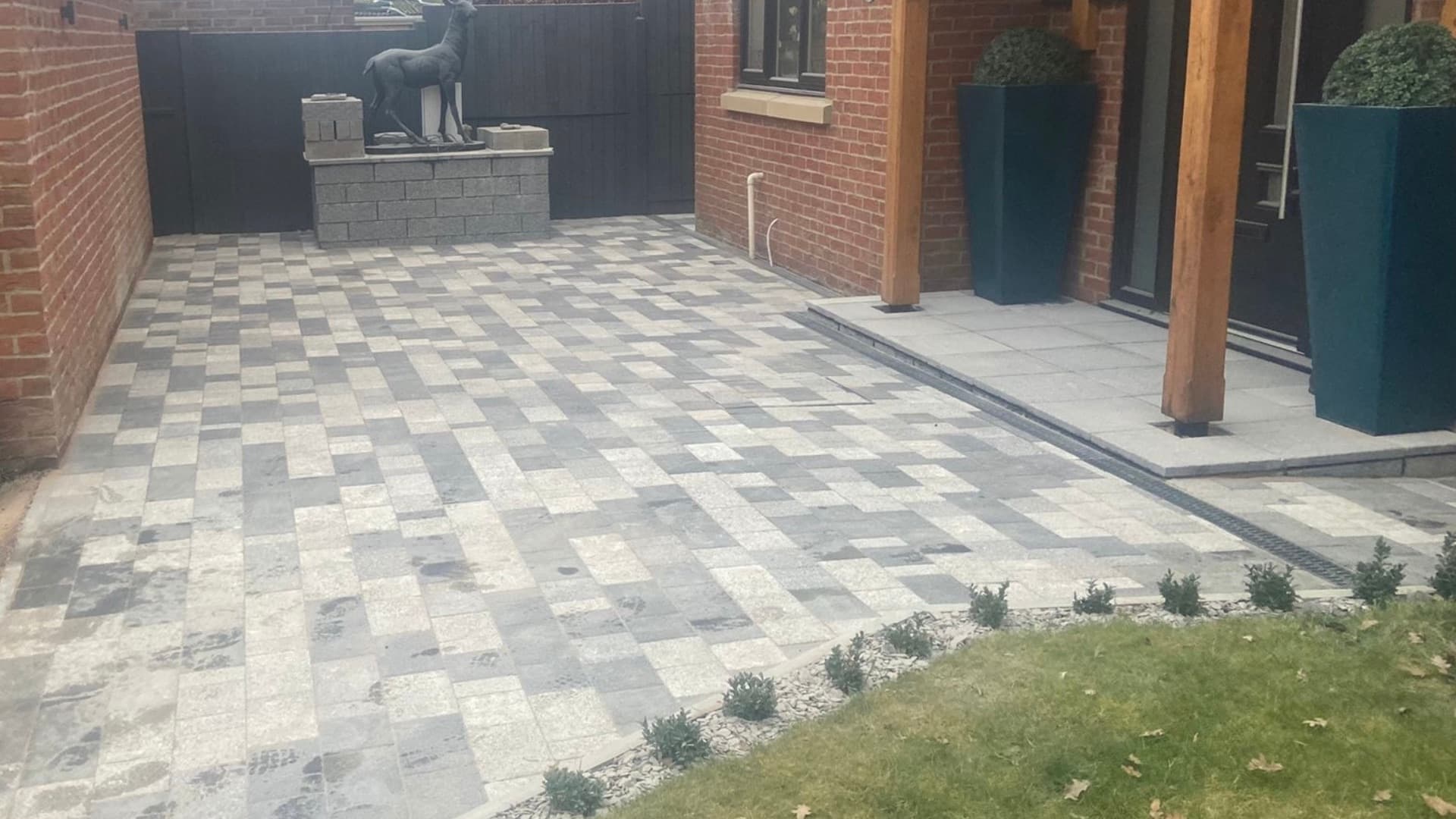 Completed block paving driveway alongside an oak-framed porch